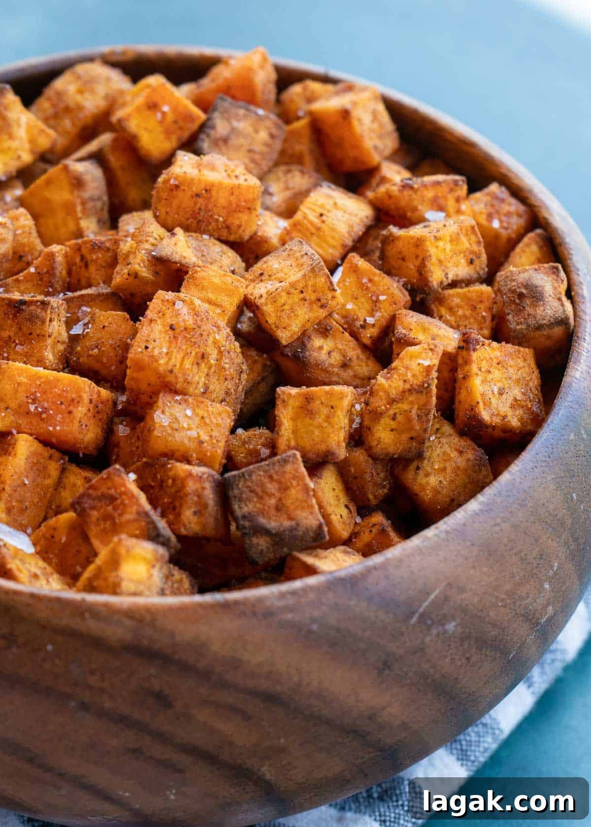 Crispy Air Fryer Sweet Potato Cubes Recipe 2 sweet potatoes in a bowl