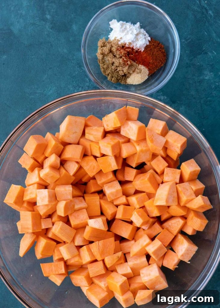 Crispy Air Fryer Sweet Potato Cubes Recipe 7 overhead shot of sweet potatoes and spices