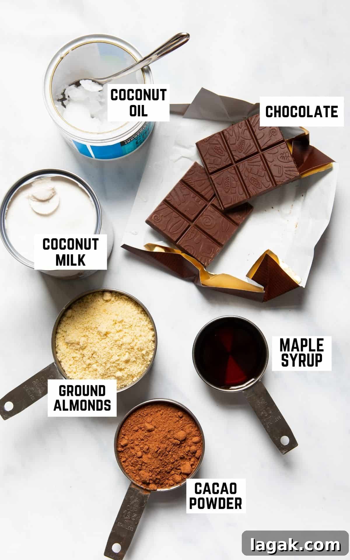 Decadent Vegan Chocolate Tart Recipe for Rich, Creamy Desserts 3 Ingredient flatlay showing coconut oil, chocolate, coconut milk, ground almonds, maple syrup, and cacao powder.