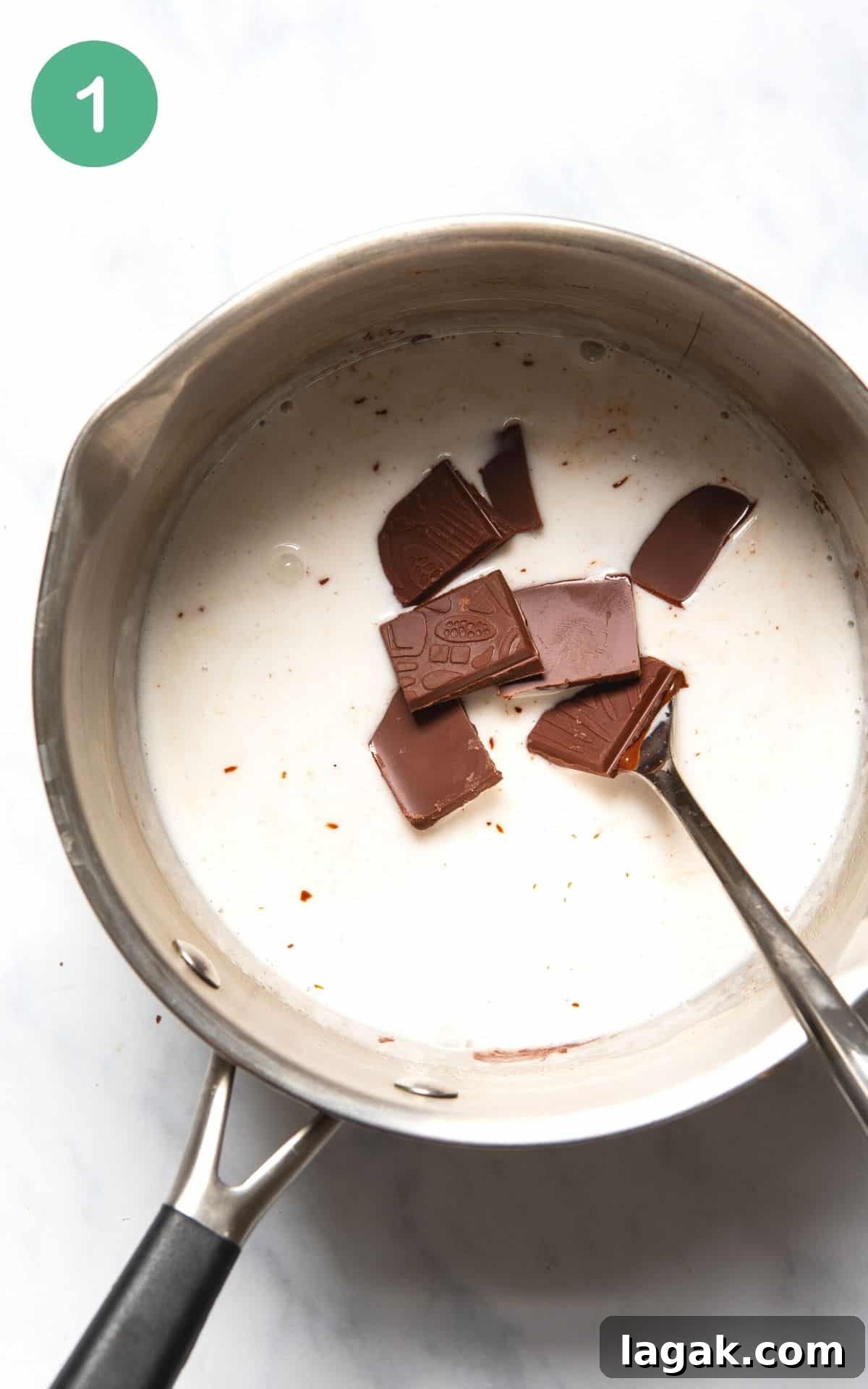 Decadent Vegan Chocolate Tart Recipe for Rich, Creamy Desserts 4 Instructional photo showing chocolate being melted with coconut milk in a silver cooking pot.