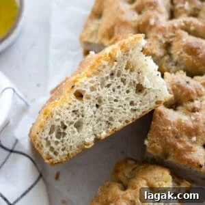 Black Pepper Focaccia Recipe: Crispy Crust & Aromatic Crumbs 8 Side view of a slice of Black Pepper Focaccia.