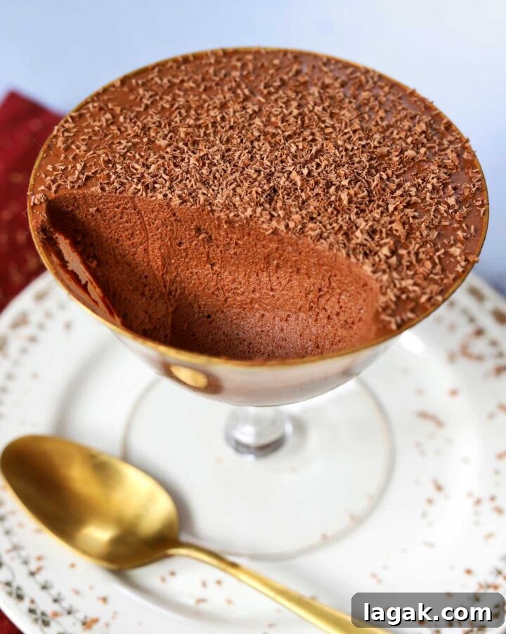 Instant Chocolate Mousse with One Ingredient — Quick Recipe 3 one ingredient chocolate mousse in dessert cup with spoon showing airy texture