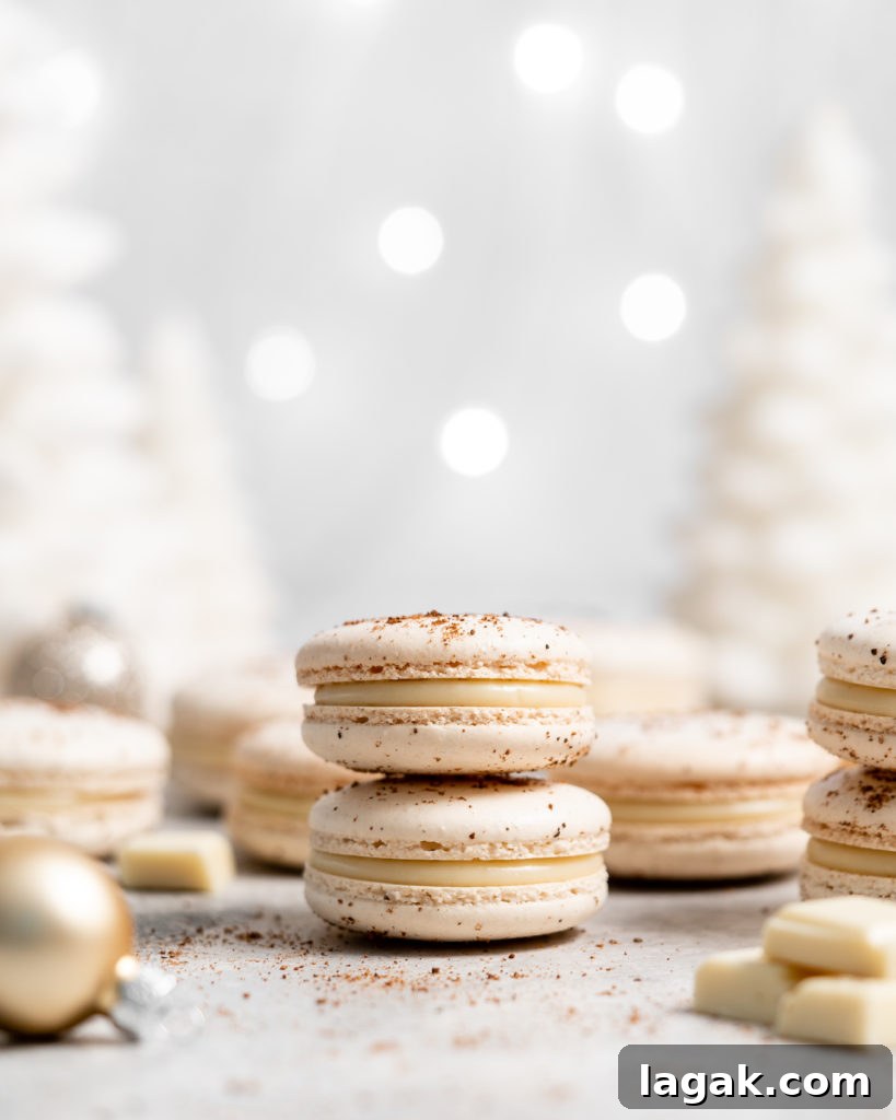 eggnog macarons filled with eggnog white chocolate ganache in a christmas scene