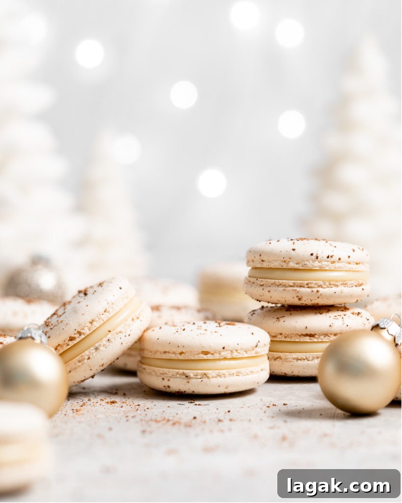 eggnog macarons filled with eggnog white chocolate ganache in a christmas scene