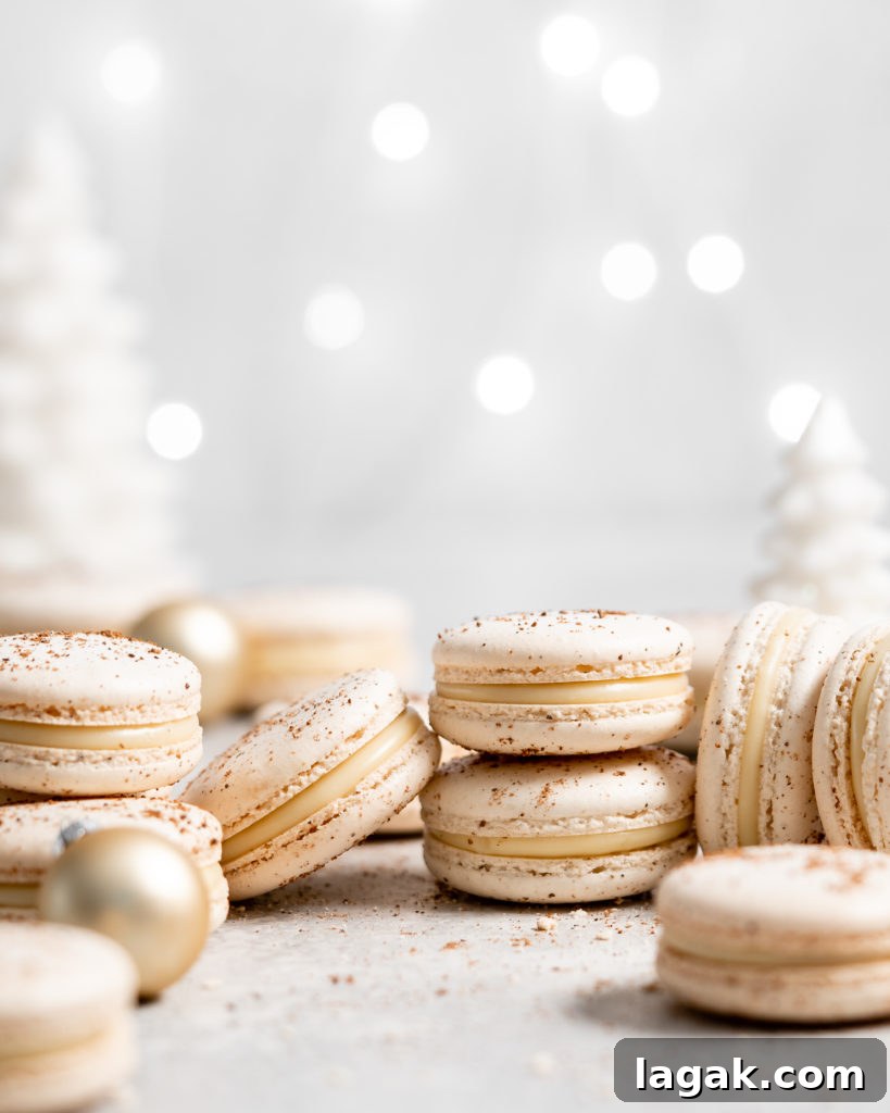 eggnog macarons filled with eggnog white chocolate ganache in a christmas scene