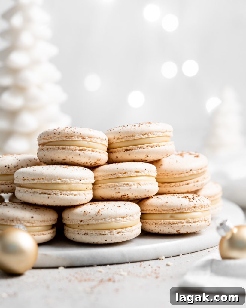 eggnog macarons filled with eggnog white chocolate ganache in a christmas scene