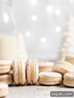 eggnog macarons filled with eggnog white chocolate ganache in a christmas scene