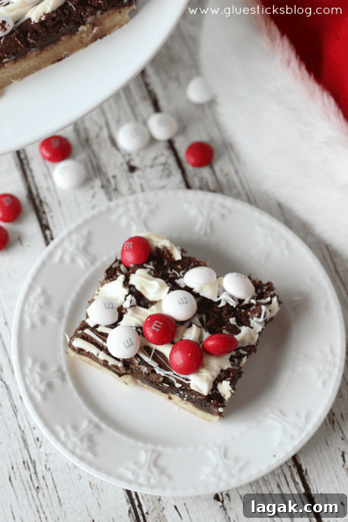 These black and white peppermint brownies combine a sugar cookie, brownie, two types of chocolate, and M&Ms White Chocolate Peppermint Candies. Absolutely beautiful and perfect to give to friends this holiday season!