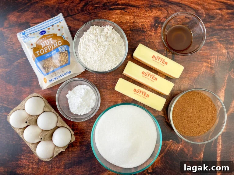 Flour, sugar, butter, eggs, cocoa, vanilla, confectioners sugar and chopped nuts on a wooden counter top are ingredients to make brownies for a crowd