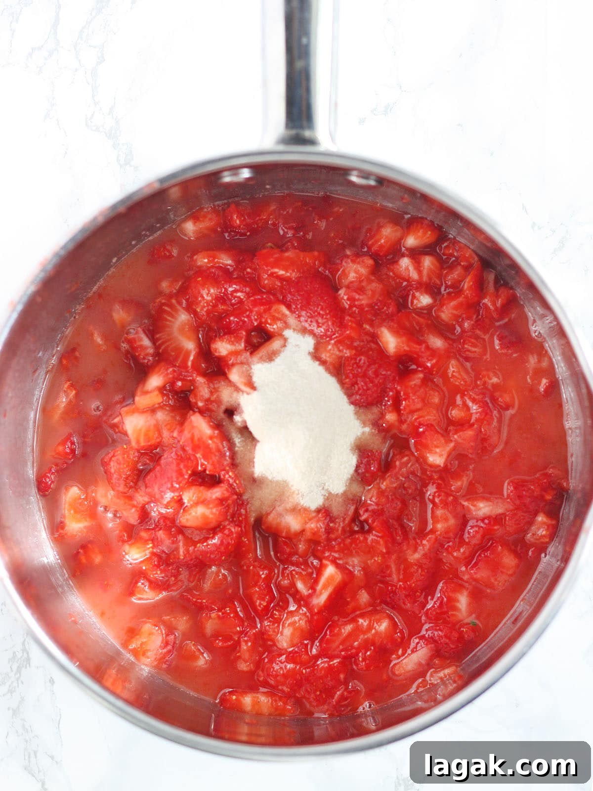 Strawberry Jam Recipe with Pectin: Smooth, Spreadable Preserves 7 Mashed strawberries with lemon juice and pectin in a stainless steel saucepan.
