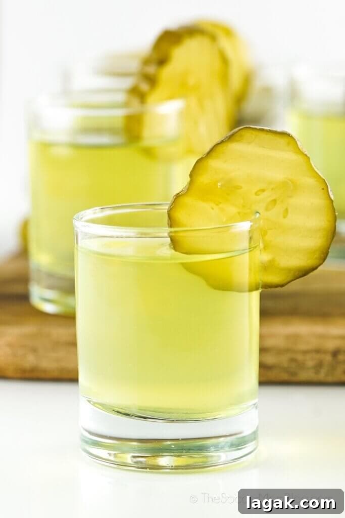 Dill Pickle Roll-Ups: Tangy Appetizer Recipe for Parties 11 Dill Pickle Shots lined up on a table