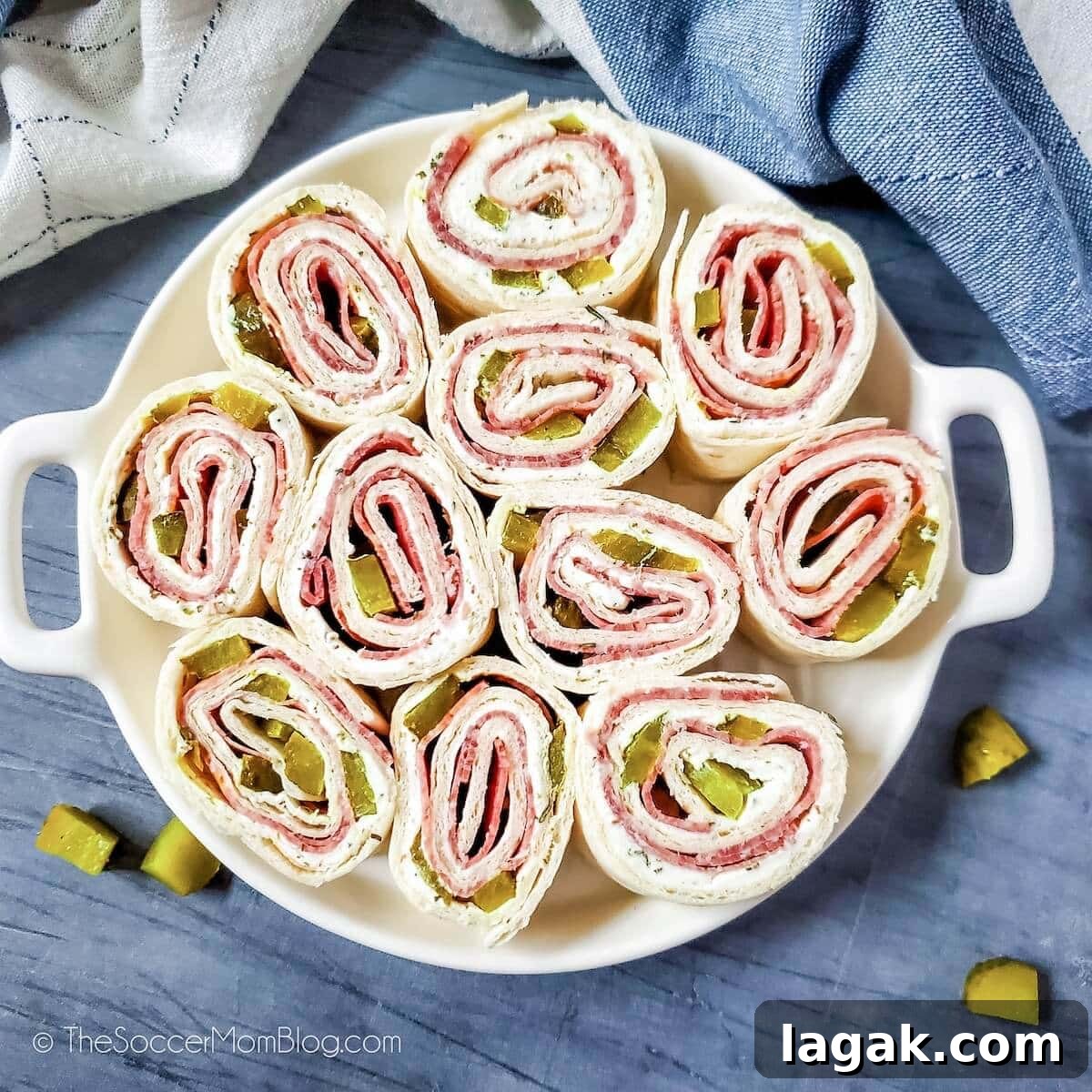 Dill Pickle Roll-Ups: Tangy Appetizer Recipe for Parties 3 Dill Pickle Pinwheels on a serving tray, top down view