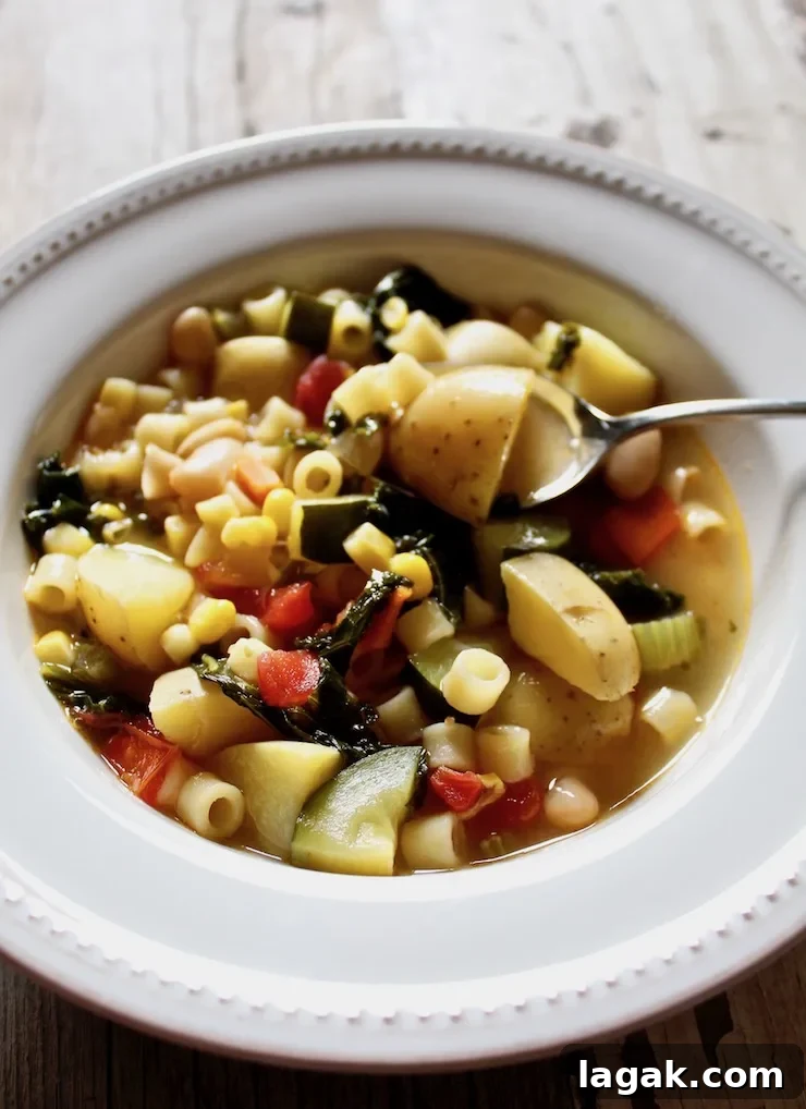 Refreshing Summer Minestrone Recipe for Seasonal Veggies 4 Summer minestrone in bowl with spoon