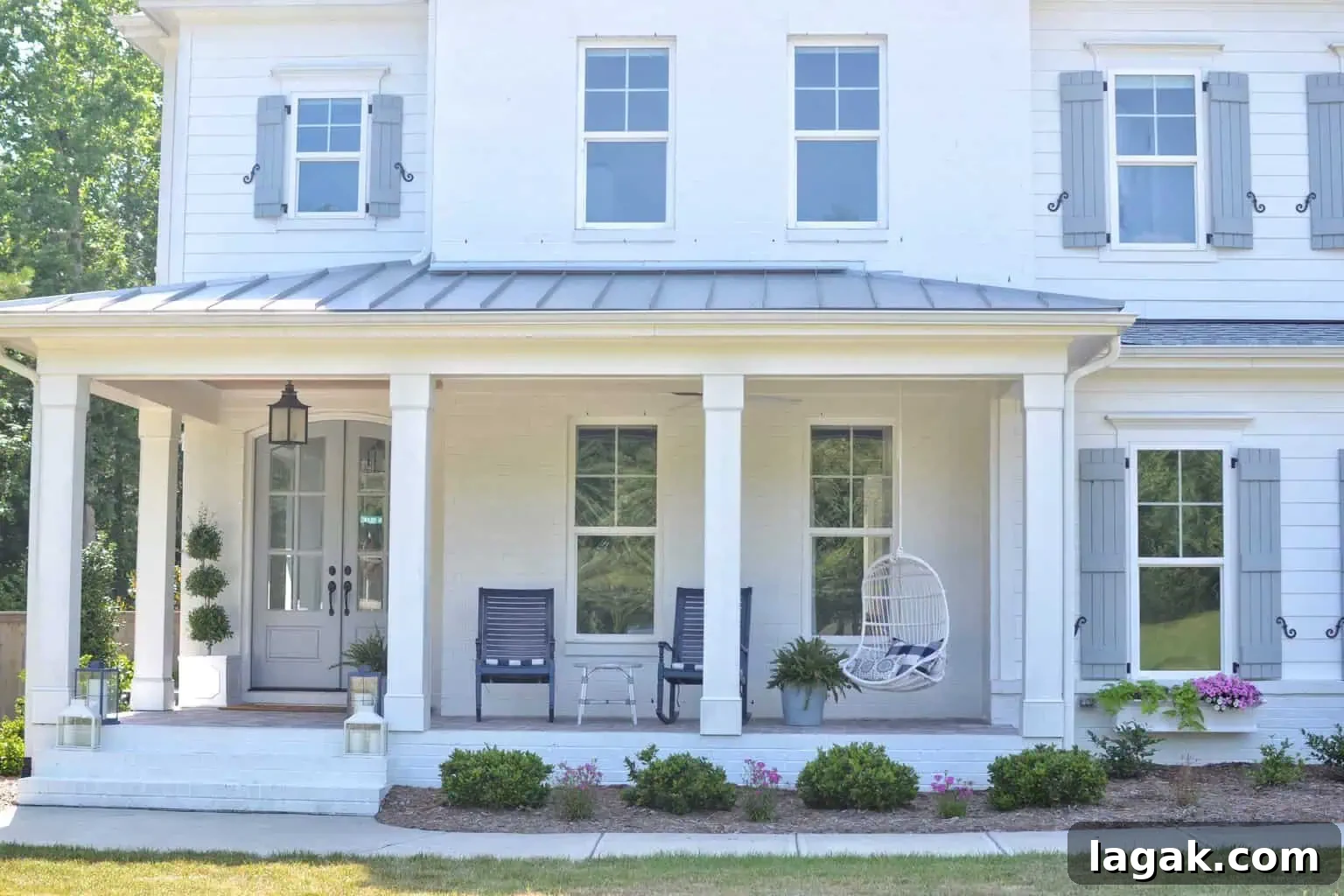 white exterior on a house with blue shutters