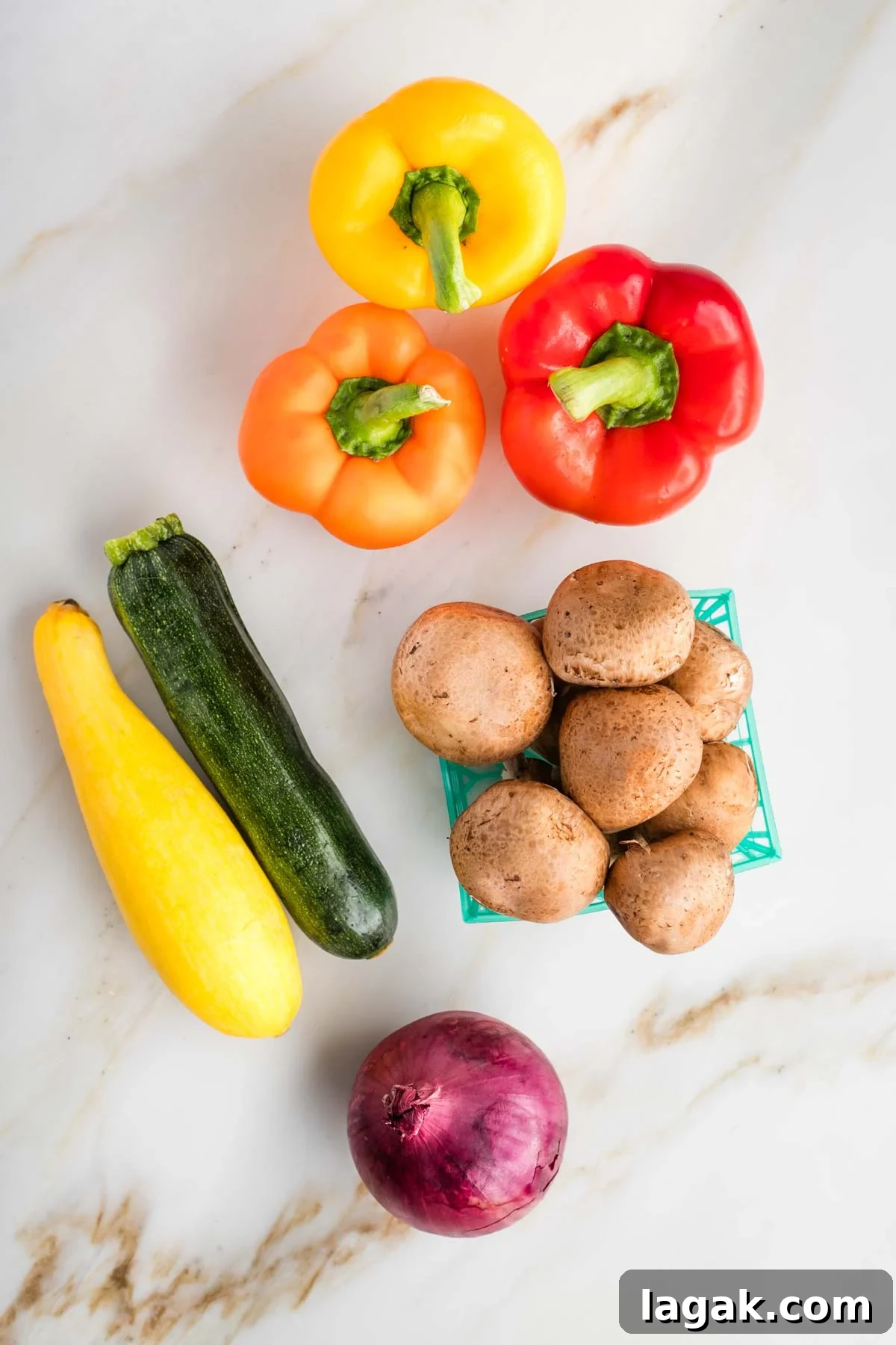 Whole bell peppers, zucchini, squash, mushrooms and red onion.