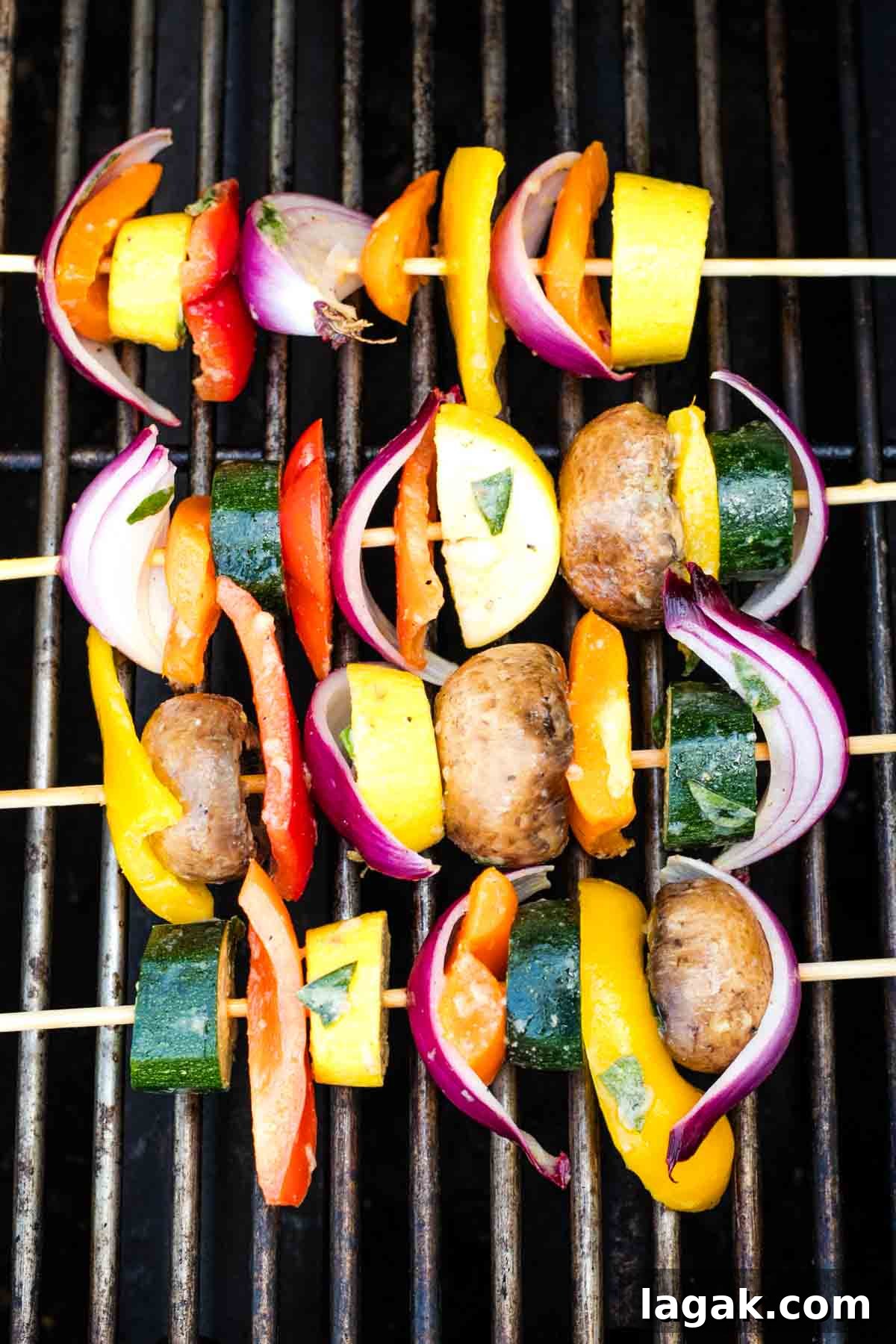 Grill with skewers of colorful vegetables. 
