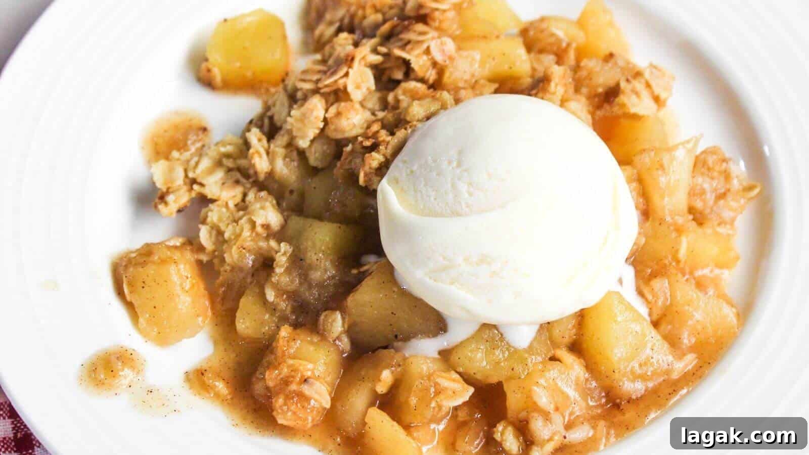 29 Party-Worthy Treats That Won’t Leave Leftovers 31 A plate of apple crisp with chunks of apple, topped with a scoop of vanilla ice cream and an oat crumble topping.