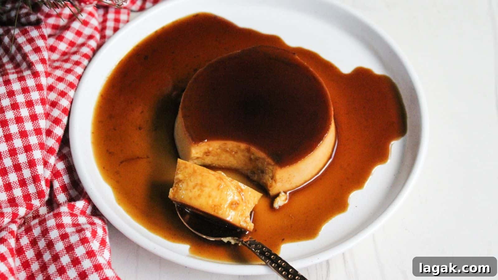 29 Party-Worthy Treats That Won’t Leave Leftovers 7 Leche flan caramel creme brulee on a plate with a spoon.