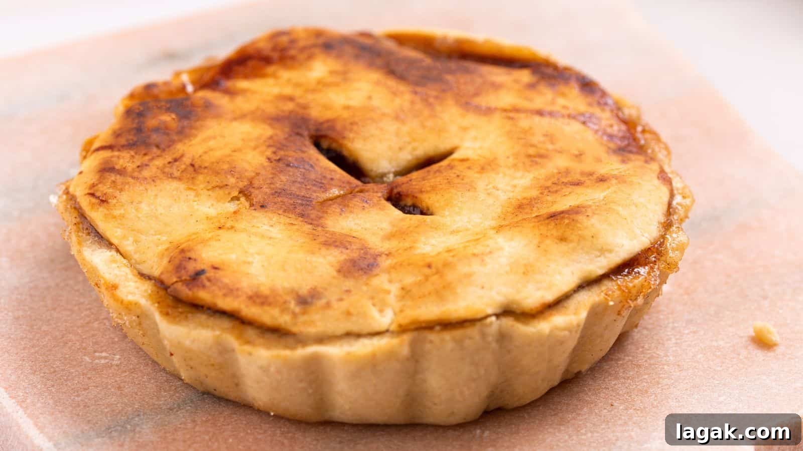 29 Party-Worthy Treats That Won’t Leave Leftovers 10 Mini apple pie on cutting board.