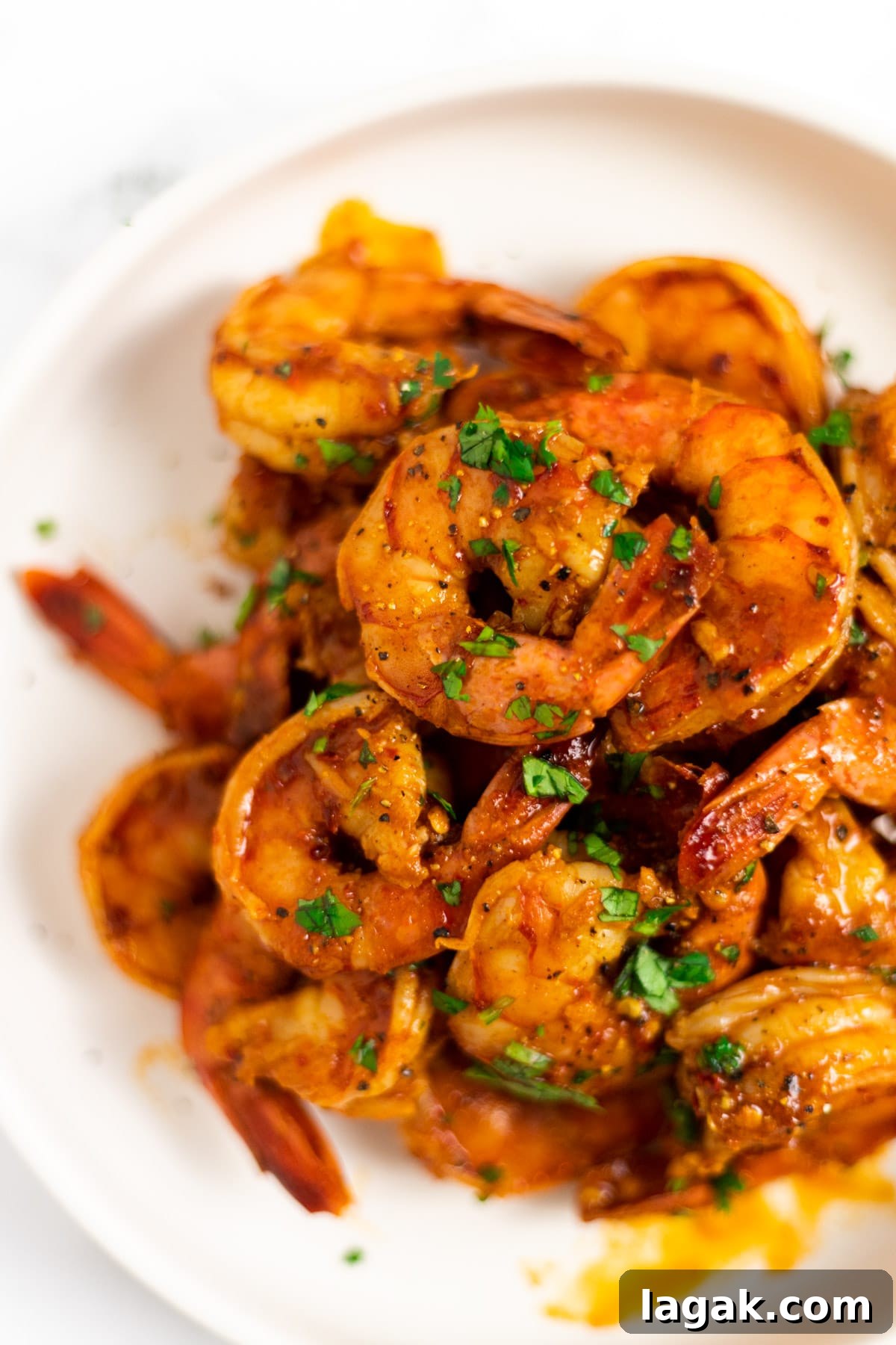 Zesty Chili-Lime Shrimp Skewers with Cilantro Lime Sauce 5 A side view of a bowl of chili lime shrimp.