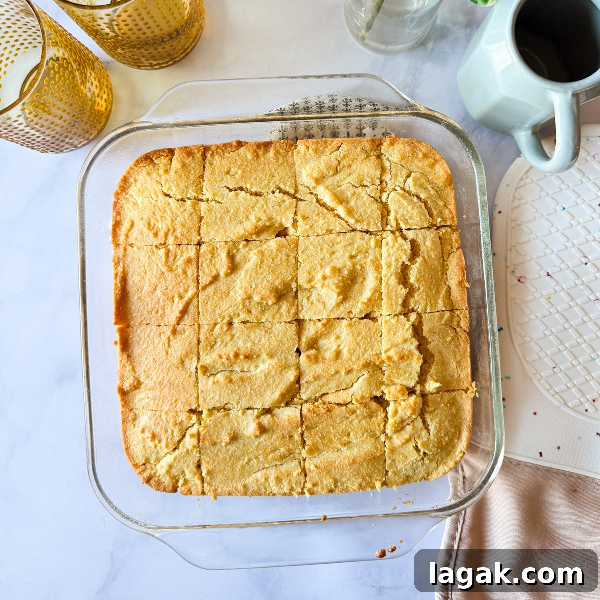 a baking dish with gluten-free cornbread that's been cut into 16 pieces. 