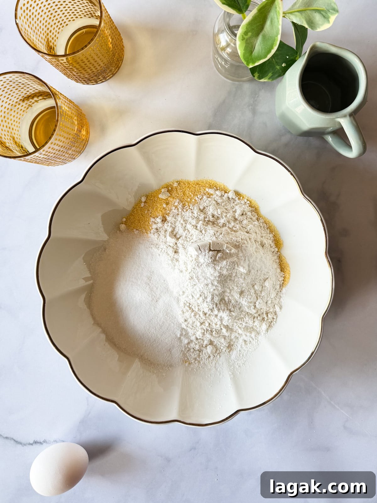 a bowl of cornmeal, gluten-free flour, sugar, baking powder, and baking soda. 