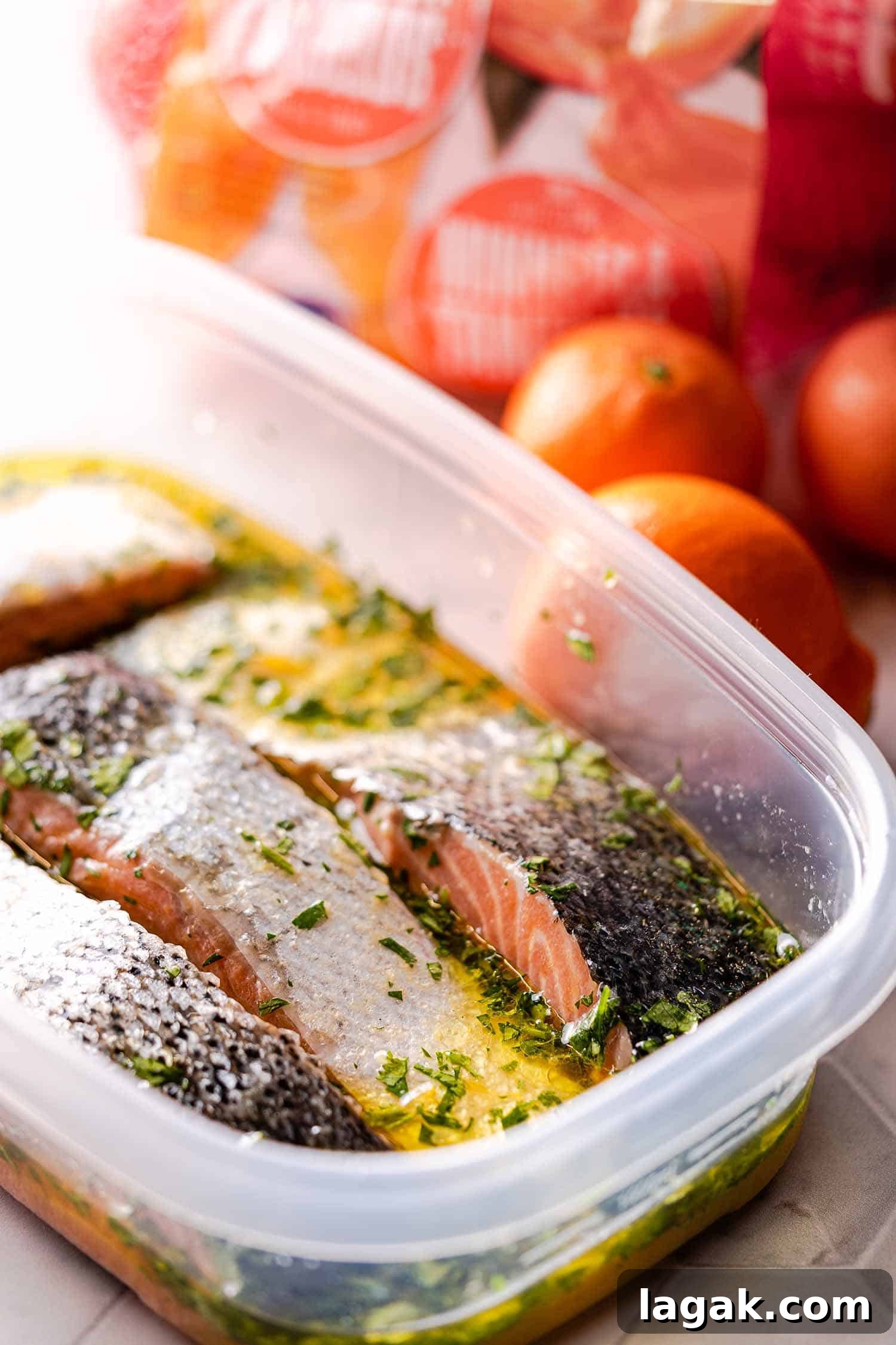 salmon marinating in plastic container