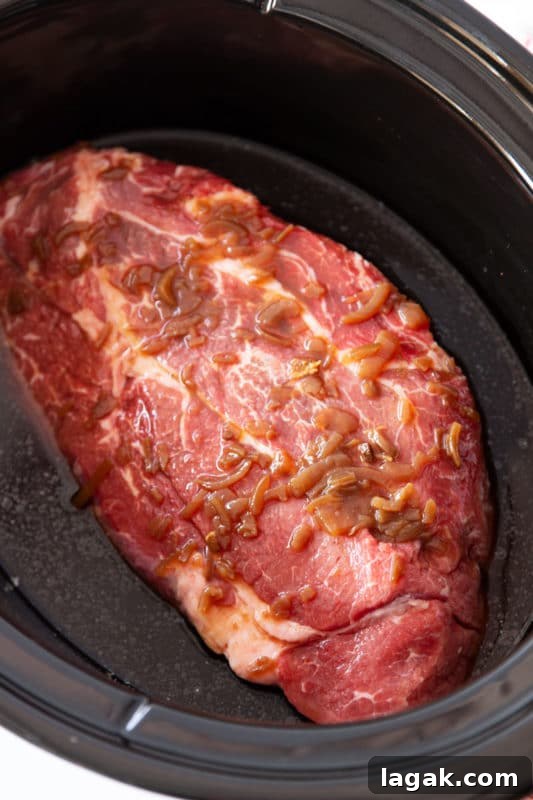 Crock-Pot French Dip Sandwich Recipe for Tender, Flavorful Beef 5 Chuck roast in a crockpot.