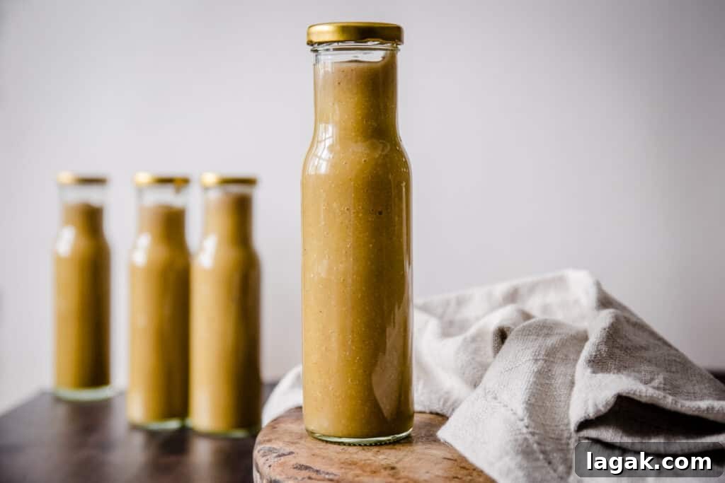 Homemade Green Tomato Ketchup Recipe: Tangy, Fresh & Preservative-Free 5 A bottle of Green tomato ketchup on a wooden board