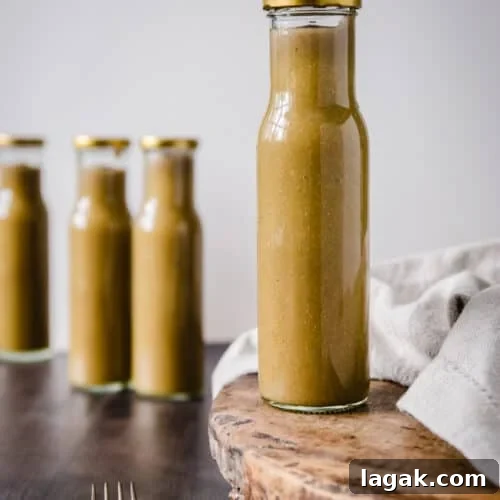 Homemade Green Tomato Ketchup Recipe: Tangy, Fresh & Preservative-Free 7 A bottle of Green tomato ketchup on a wooden board