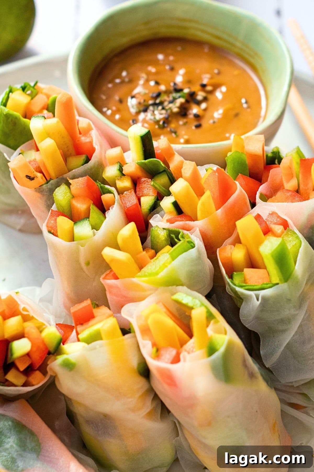 Colorful fresh summer rolls on plate.