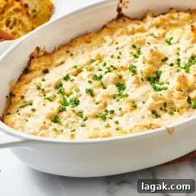 White dish with baked crab dip.