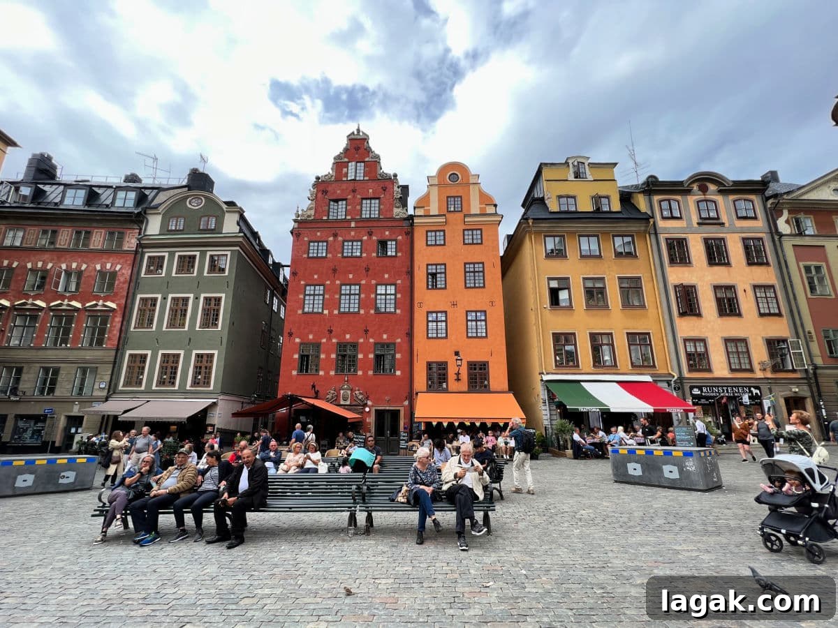 Avoid Saying This When Planning Your Next Trip: Travel Tips 4 A group of people sitting on a bench in front of colorful buildings.
