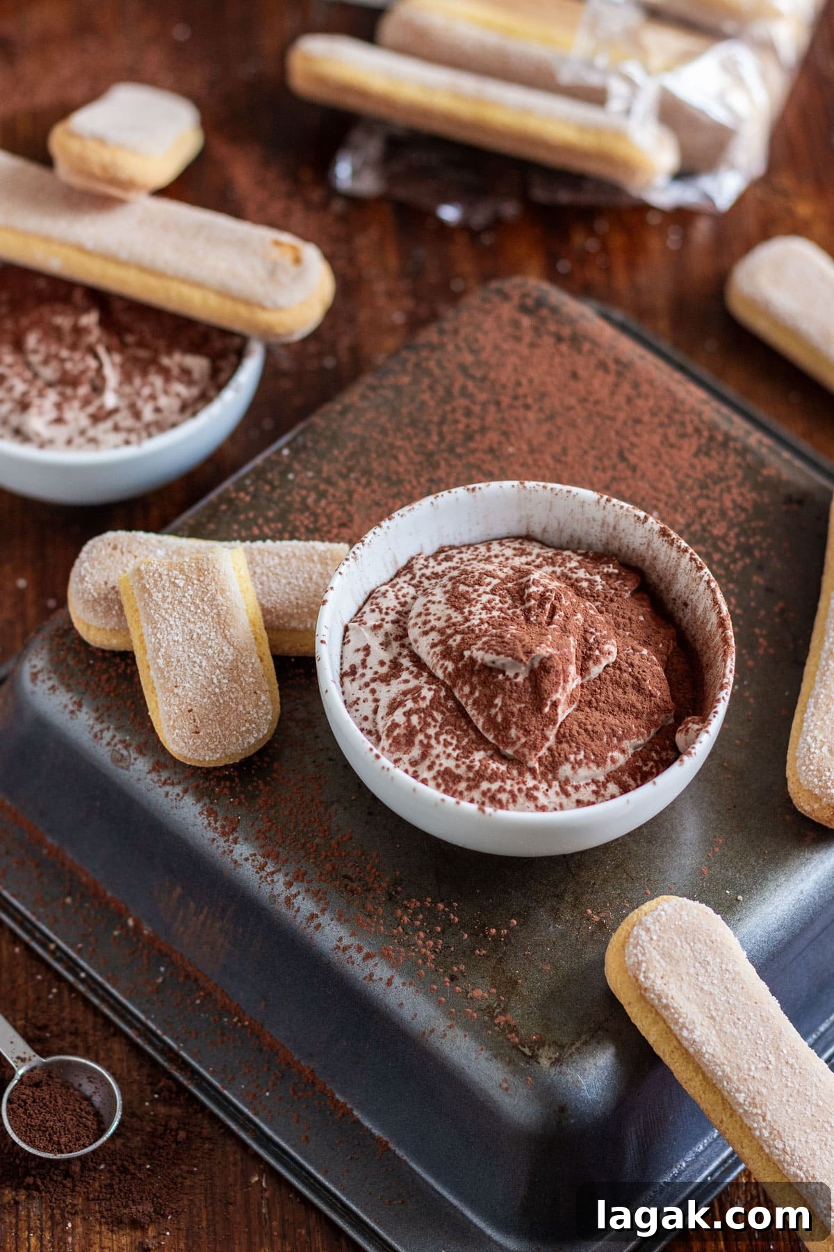 Quick Tiramisu Dip — Ready in 5 Minutes 3 Ladyfingers and a bowl of tiramisu dip dusted with cocoa powder.