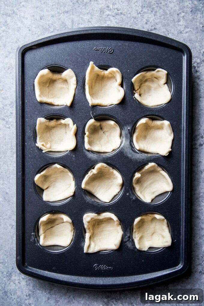Cardamom Blackberry Brie Bites with Honey and Crispy Phyllo 5 crescent dough in a muffin tin