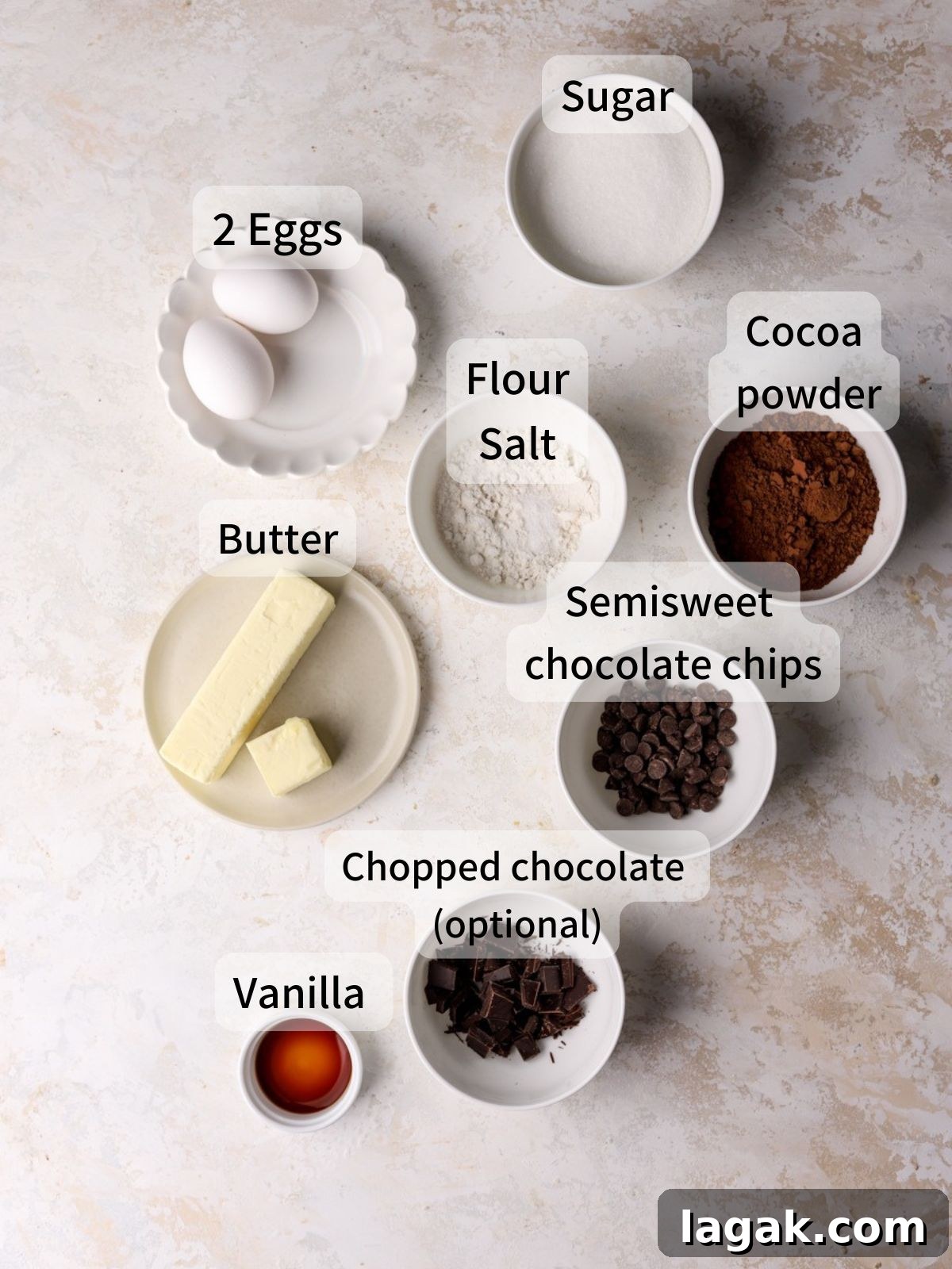 Irresistible Brown Butter Brownies Recipe for Rich, Nutty Flavor 3 Labeled ingredients needed to make brown butter brownies laid out on a table.
