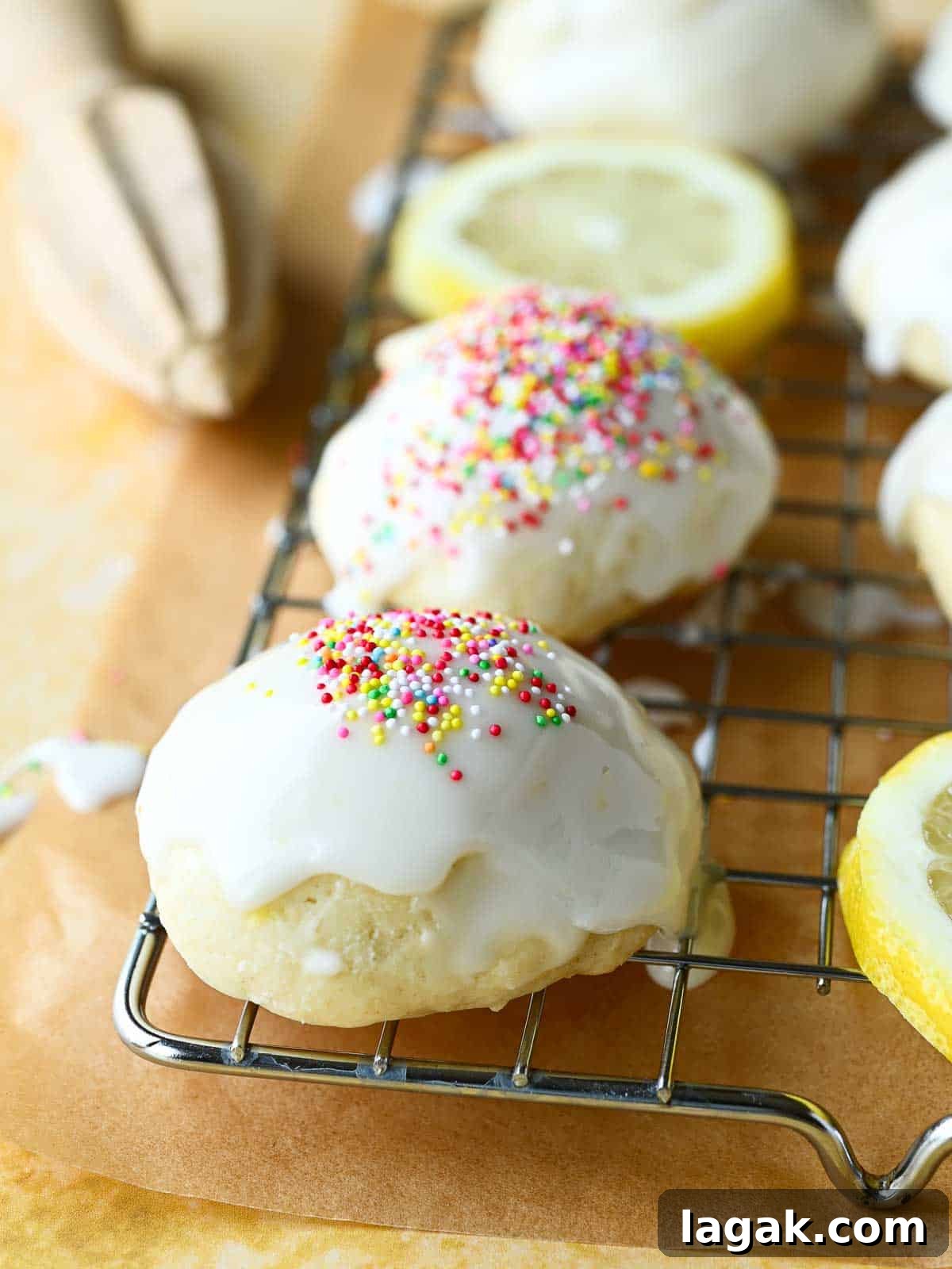 Italian Lemon Drop Cookies Recipe — Zesty Citrus Biscotti-Style Treat 2 Close-up of Italian lemon drop cookies on a wire rack with multi-colored sprinkles on top.