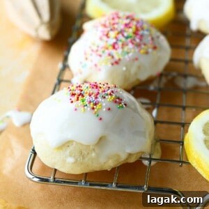 Italian Lemon Drop Cookies Recipe — Zesty Citrus Biscotti-Style Treat 16 Close-up of Italian lemon drop cookies on a wire rack with multicolored sprinkles on top.