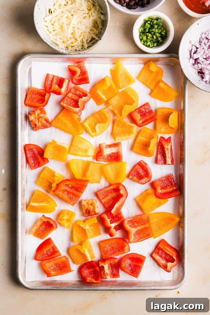 Bell Pepper Nachos with Zesty Cheese and Fresh Toppings 4 Sliced bell peppers on a parchment-lined sheet pan