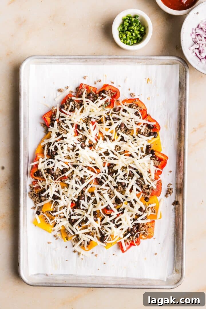 Bell Pepper Nachos with Zesty Cheese and Fresh Toppings 7 Bell peppers on a sheet pan topped with cheese