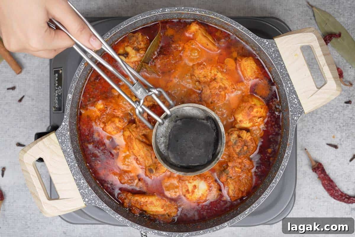Chicken Angara Recipe: Spicy Grilled Chicken with Smoky Sauce 17 Removing the bowl.