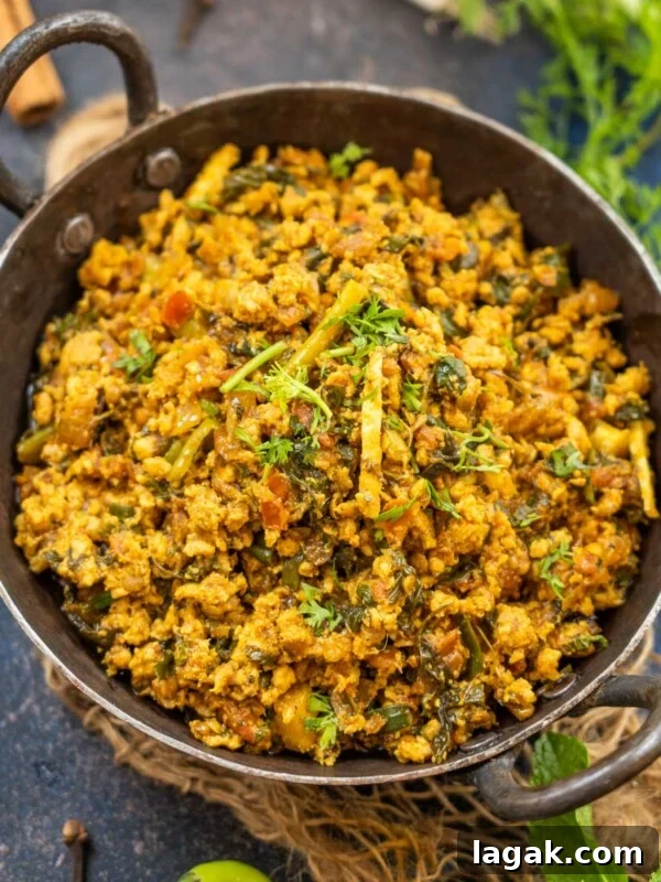 Chicken Angara Recipe: Spicy Grilled Chicken with Smoky Sauce 21 Chicken Keema Masala in a bowl with garnish.