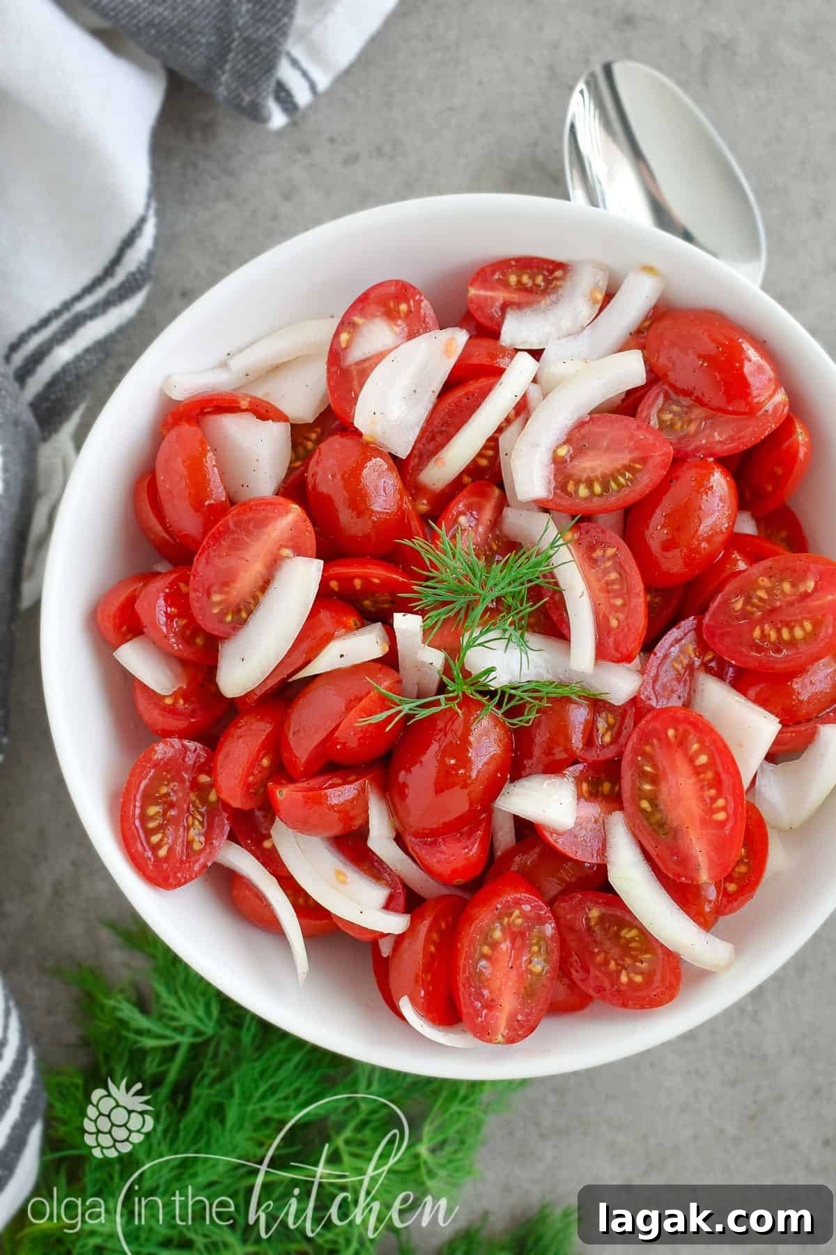 This super Quick Tomato Salad is a summer favorite at every BBQ party. Simple, fresh and delicious and only takes 10 minutes to put together! | olgainthekitchen.com