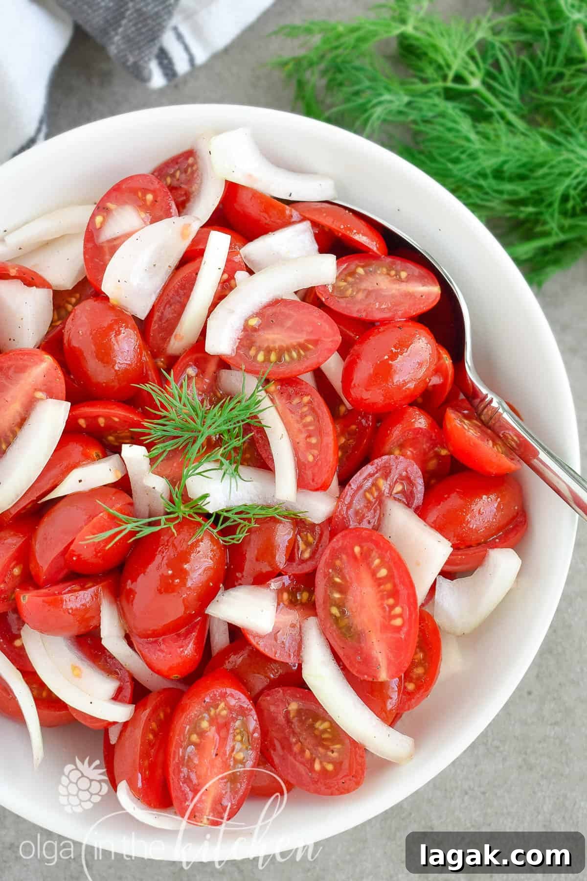 This super Quick Tomato Salad is a summer favorite at every BBQ party. Simple, fresh and delicious and only takes 10 minutes to put together! | olgainthekitchen.com