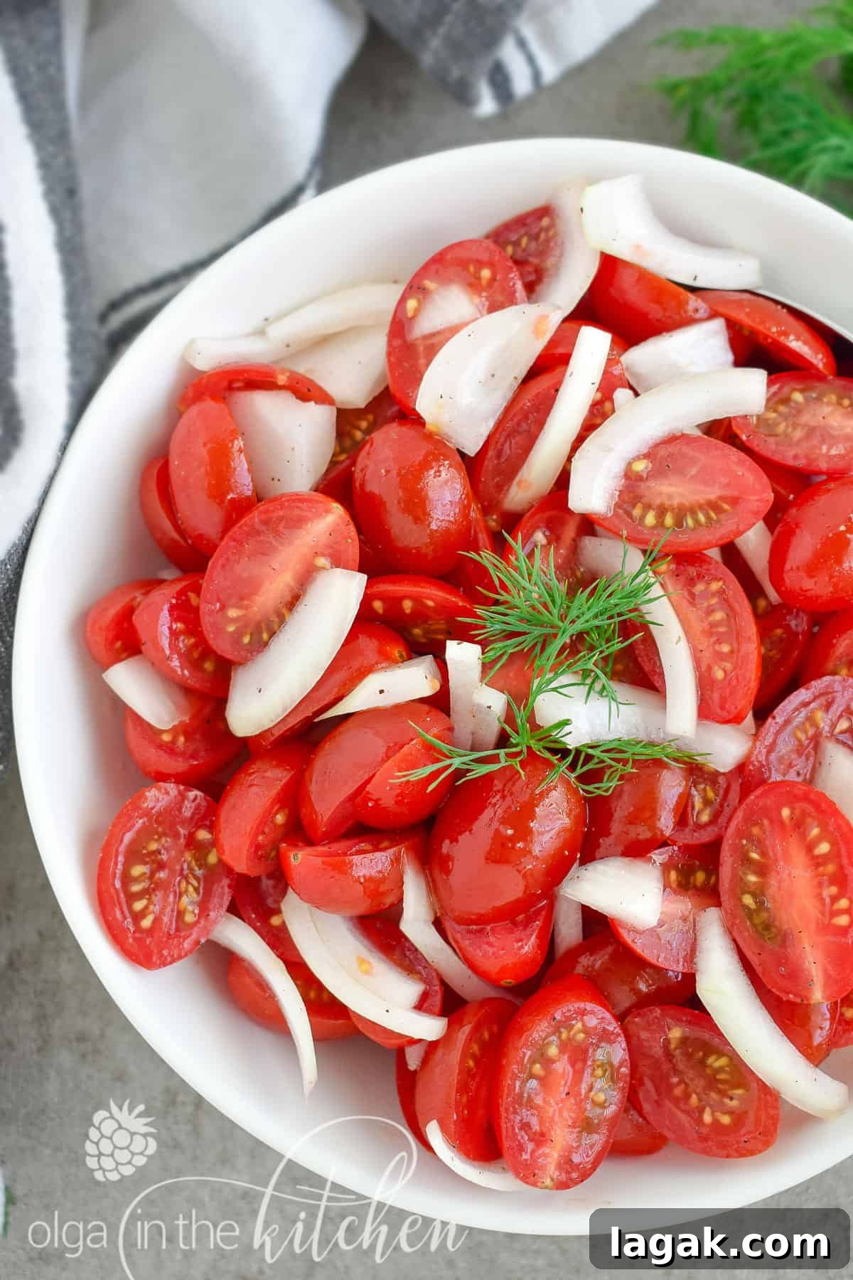 This super Quick Tomato Salad is a summer favorite at every BBQ party. Simple, fresh and delicious and only takes 10 minutes to put together! | olgainthekitchen.com