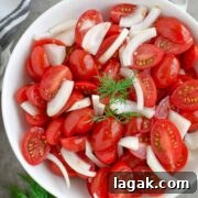 This super Quick Tomato Salad is a summer favorite at every BBQ party. Simple, fresh and delicious and only takes 10 minutes to put together! | olgainthekitchen.com