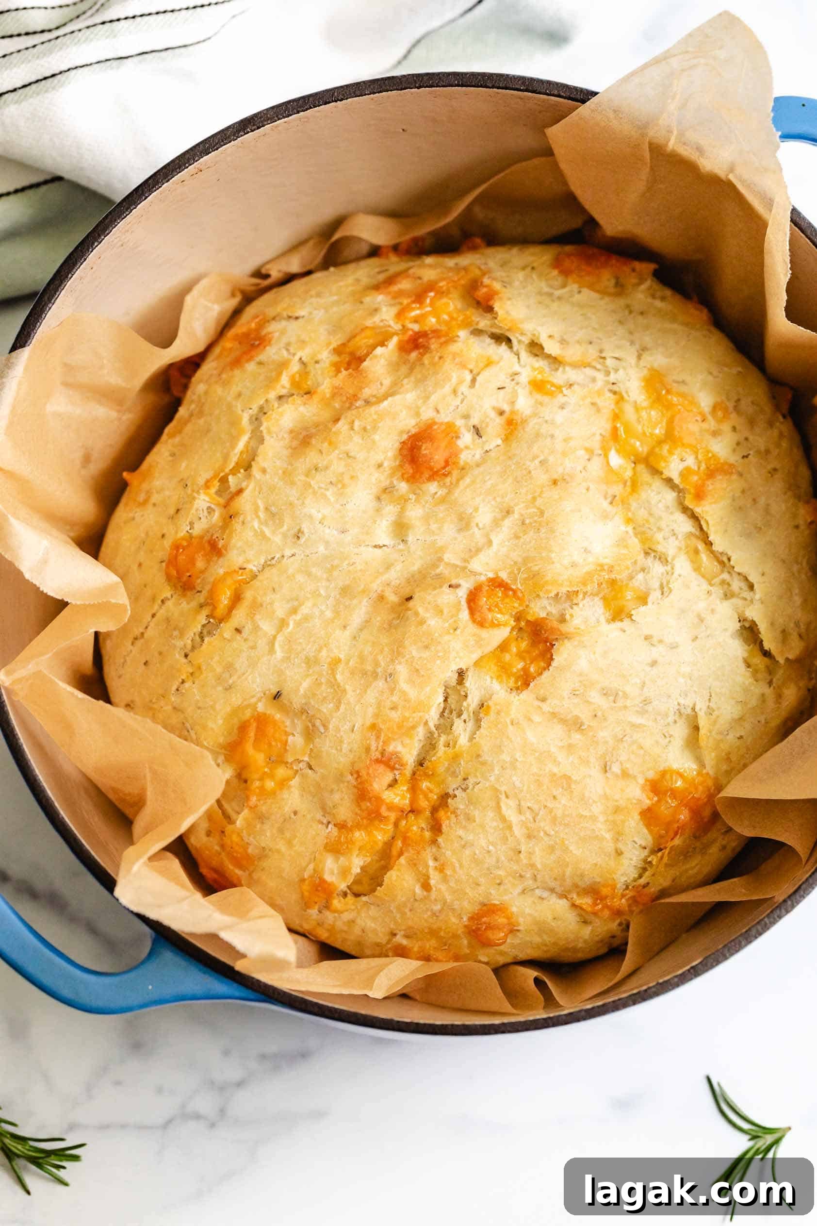 Rosemary Parmesan Loaf Recipe: Crispy Crust, Savory Interior 2 Loaf of rustic bread in a pan.