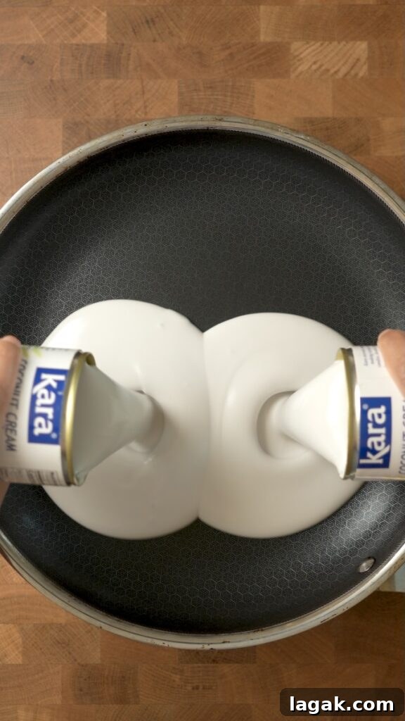 How to Make Latik Coconut Curds at Home 8 Pouring coconut cream into a pan