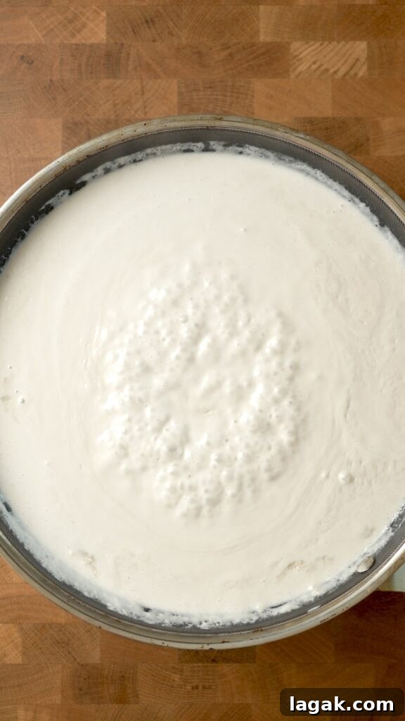 How to Make Latik Coconut Curds at Home 9 coconut cream beginning to simmer