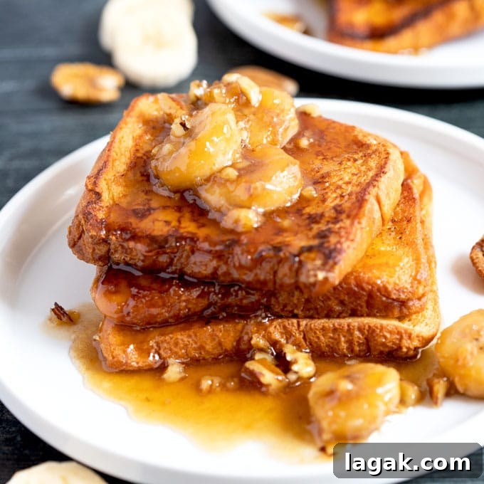 14 Romantic Valentine's Day Recipes to Make at Home 2 Banana Foster topping served over French toast on a white plate.